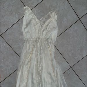 A white long dress with an open back